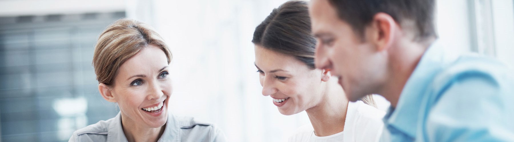 Three people in meeting